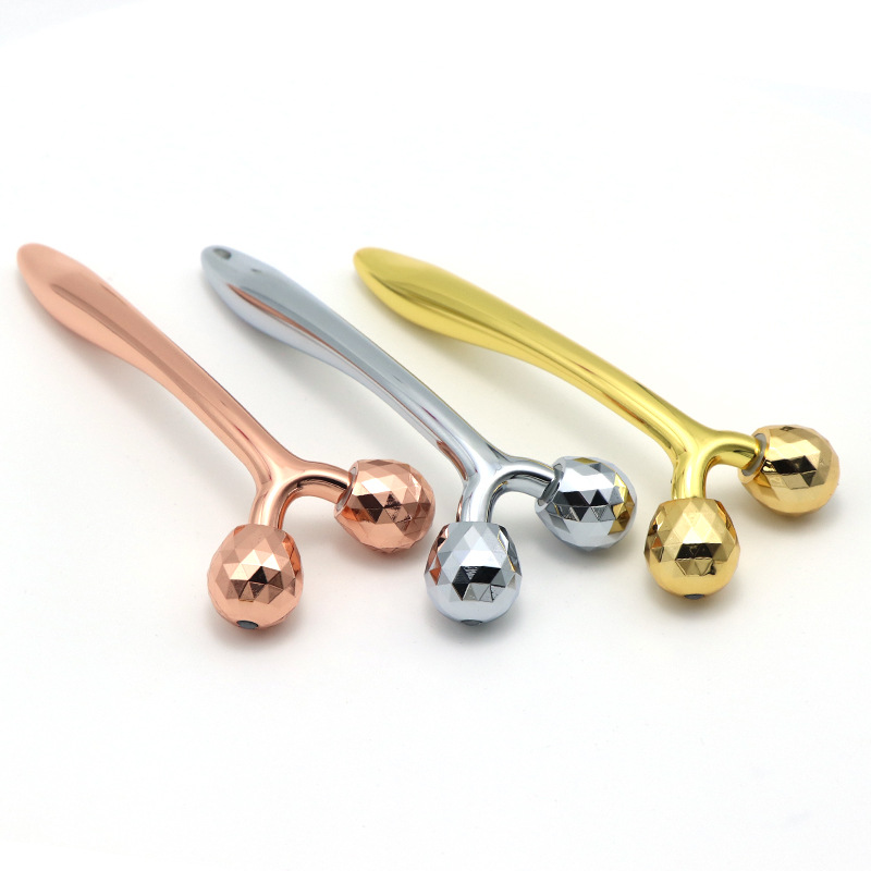 نوار زیبایی ماساژ سه بعدی Y Shape لیفتینگ صورت دستی مراقبت از پوست ضد پیری غلتک صورت فلزی طلای 24 عیار