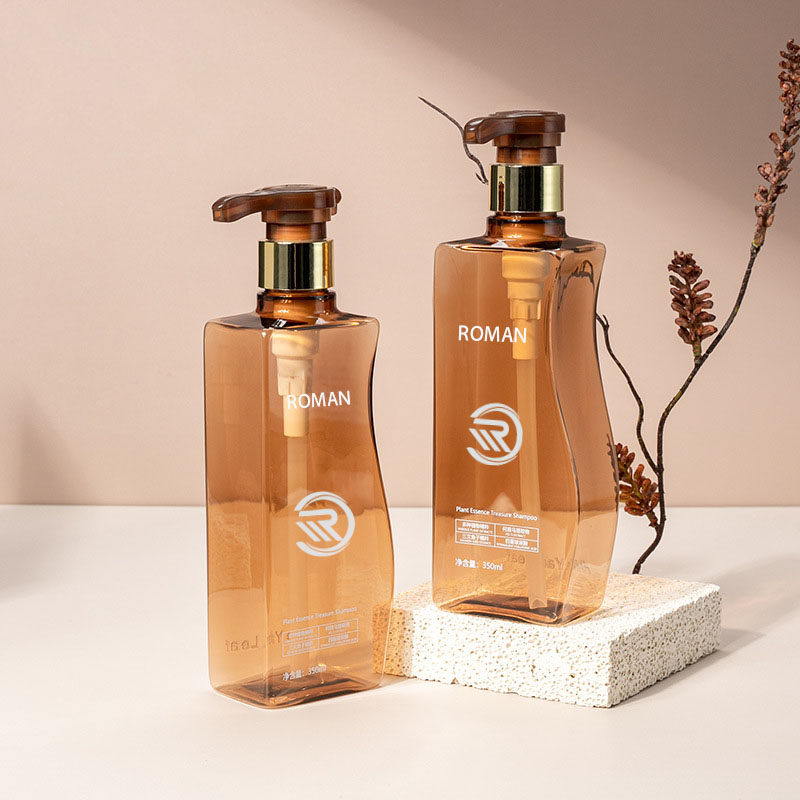 بطری لوسیون بدن خالی 350 میلی لیتری 500 میلی لیتری منحنی شکل کهربایی پت با پمپ برای شامپوی مراقبت از مو یا استفاده از کرم صورت